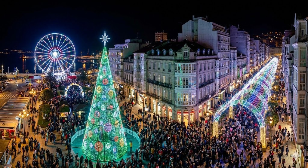 Vista nocturna de Vigo con árbol de Navidad iluminado y noria gigante